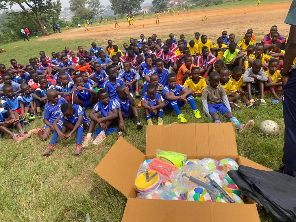 An international volunteer coaching alongside young players